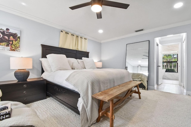 bedroom with ceiling fan, ornamental molding, and ensuite bathroom