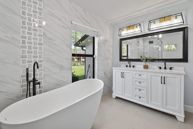 bathroom featuring vanity, separate shower and tub, and tile walls