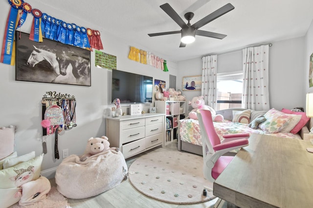 bedroom featuring ceiling fan and light hardwood / wood-style floors