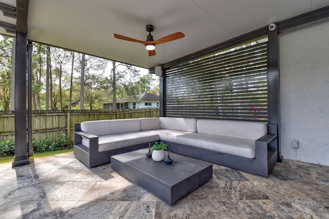 sunroom with ceiling fan and a healthy amount of sunlight