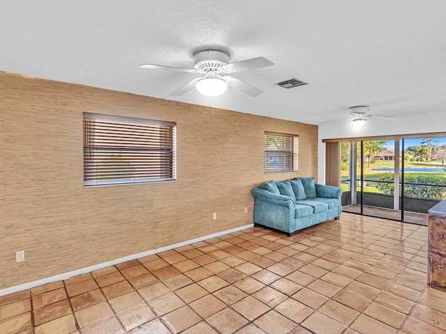 interior space featuring ceiling fan