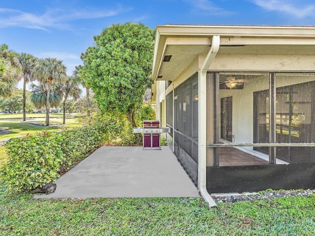 view of patio featuring a sunroom