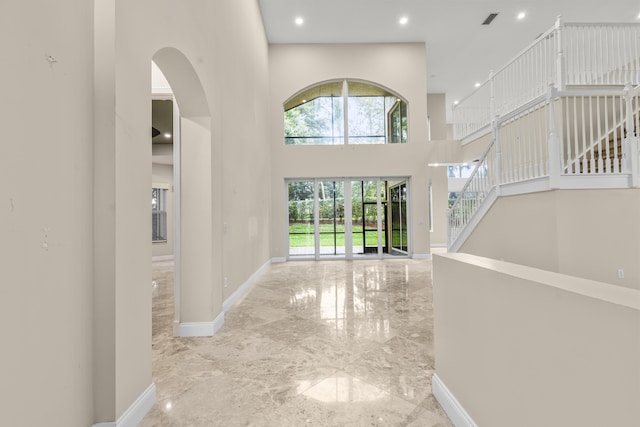 interior space with a towering ceiling