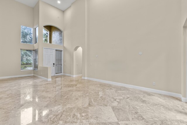 bathroom featuring tile patterned flooring, vanity, toilet, and walk in shower