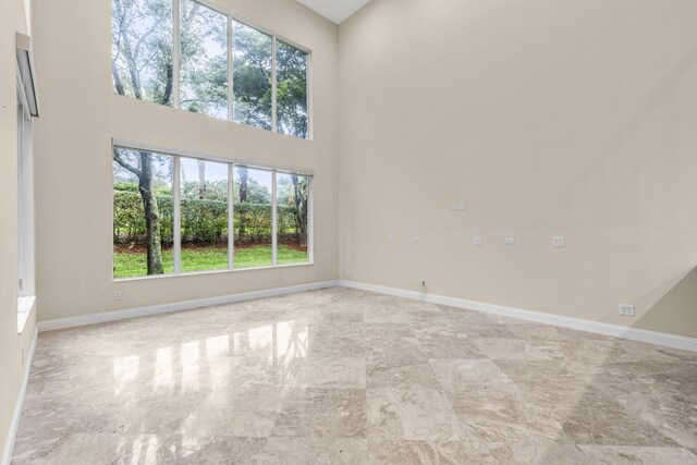 bathroom featuring vanity, a tray ceiling, toilet, and walk in shower