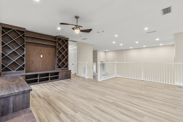 interior space featuring ceiling fan and light wood-type flooring