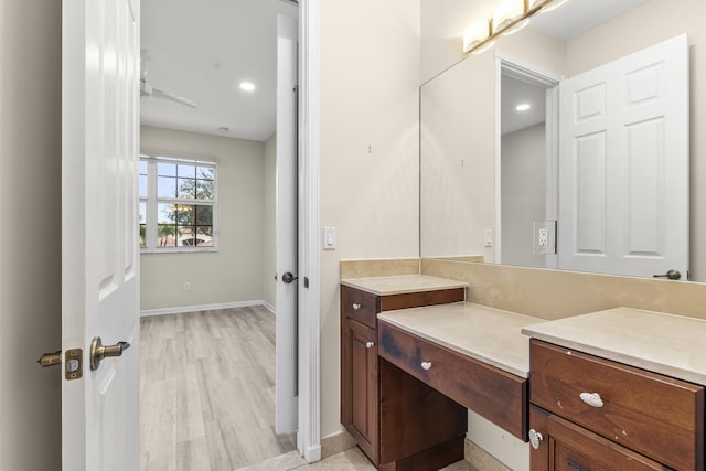 bathroom featuring vanity and wood-type flooring