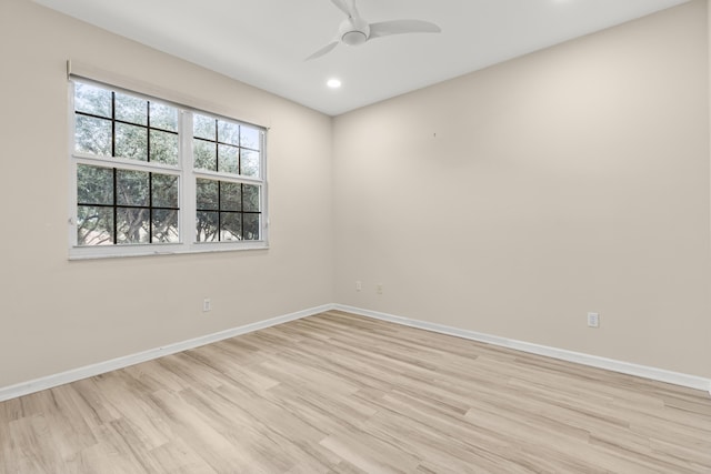 unfurnished room featuring ceiling fan and light hardwood / wood-style flooring