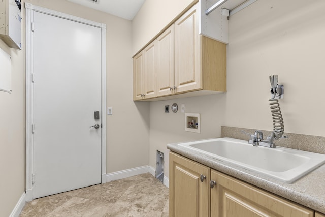 washroom with cabinets, washer hookup, sink, and electric dryer hookup