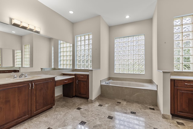 bathroom with vanity and a bathtub