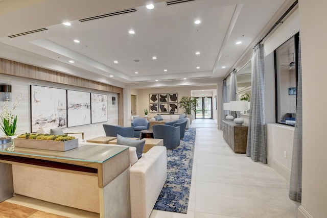 living room featuring a raised ceiling