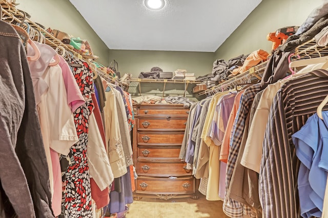 walk in closet with tile patterned flooring