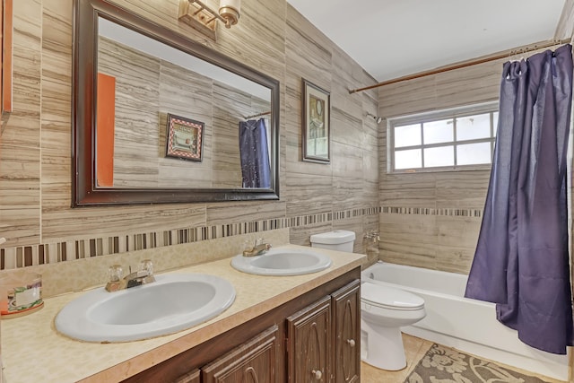 full bathroom with tile patterned flooring, vanity, shower / tub combo, and toilet