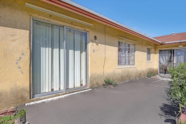 doorway to property featuring a patio