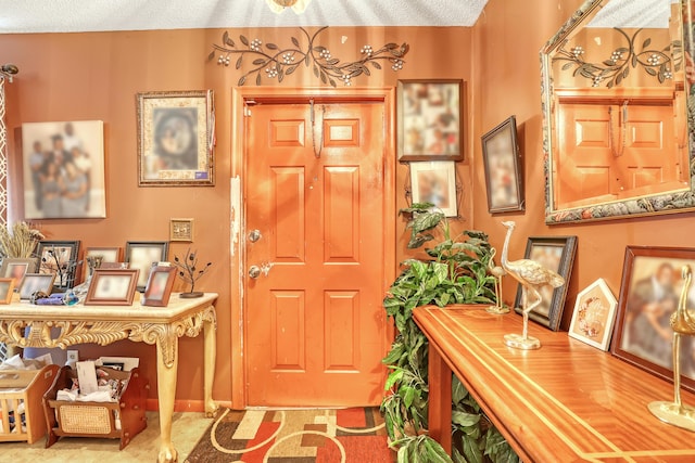 entrance foyer featuring a textured ceiling