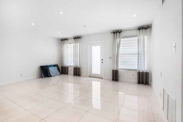 foyer featuring light tile patterned floors