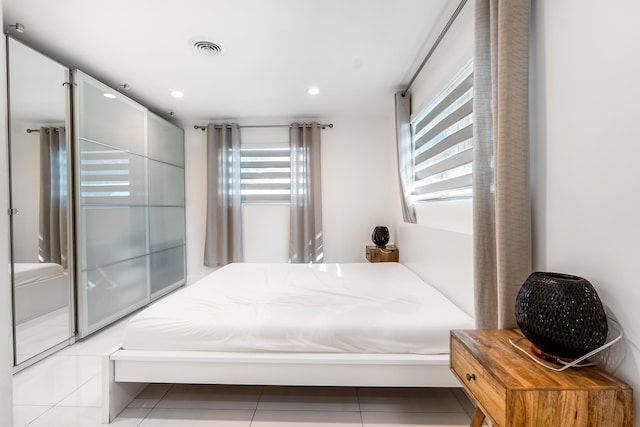 bedroom featuring light tile patterned floors