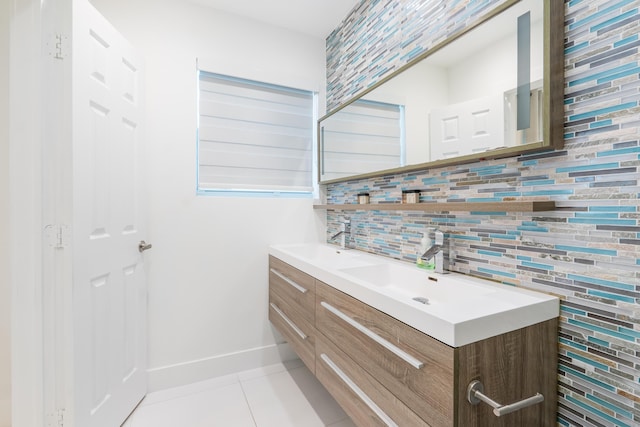 bathroom with tasteful backsplash, tile patterned floors, and vanity