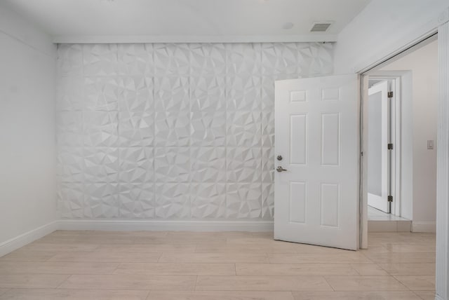 unfurnished room with light wood-type flooring