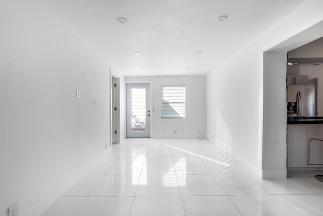 foyer entrance featuring light tile patterned floors