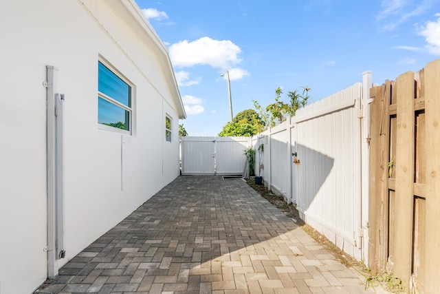 view of property exterior with a patio area