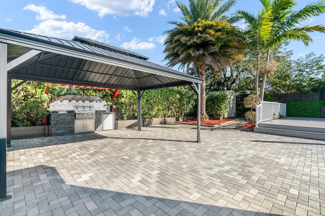 view of car parking featuring a gazebo