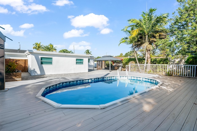 view of pool with a gazebo and a deck