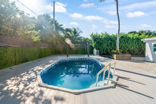 view of pool with a deck and a patio area