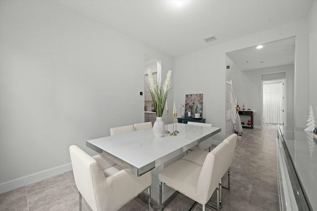 dining space featuring visible vents and baseboards