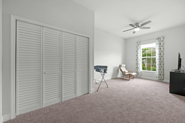 unfurnished room featuring carpet floors, baseboards, and a ceiling fan