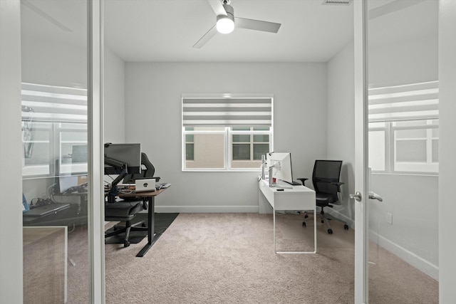 office space with carpet floors and ceiling fan