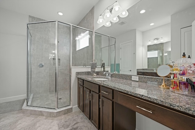 bathroom with recessed lighting, visible vents, a stall shower, vanity, and baseboards