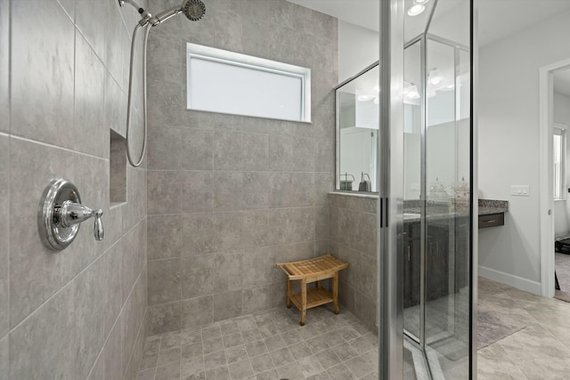 bathroom featuring a tile shower