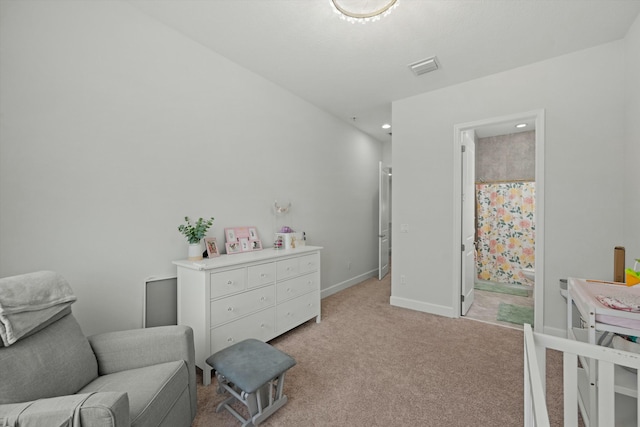 bedroom featuring light carpet, visible vents, and baseboards