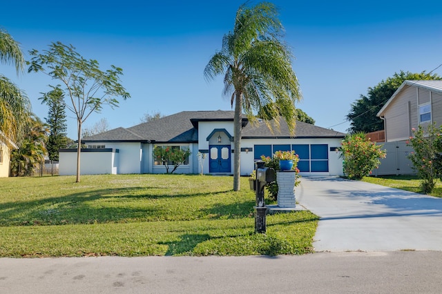 view of front facade featuring a front lawn and a garage