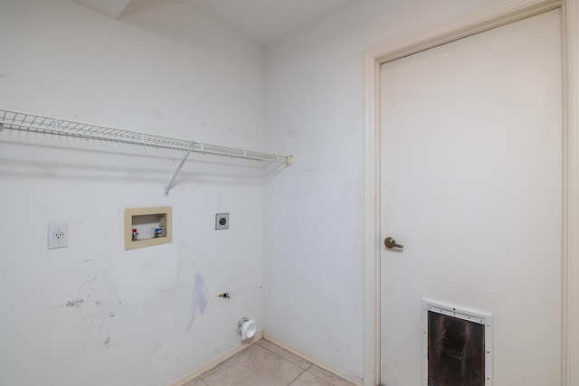 washroom featuring hookup for an electric dryer, hookup for a gas dryer, light tile patterned floors, and hookup for a washing machine