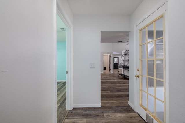 hall featuring french doors and dark hardwood / wood-style floors