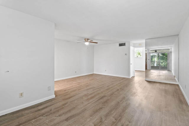 109 Paradise Harbour Blvd Unit 309, North Palm Beach, FL 33408 - unfurnished living room with a ceiling fan and wood finished floors