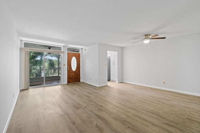 109 Paradise Harbour Blvd Unit 309, North Palm Beach, FL 33408 - unfurnished living room with wood finished floors and ceiling fan