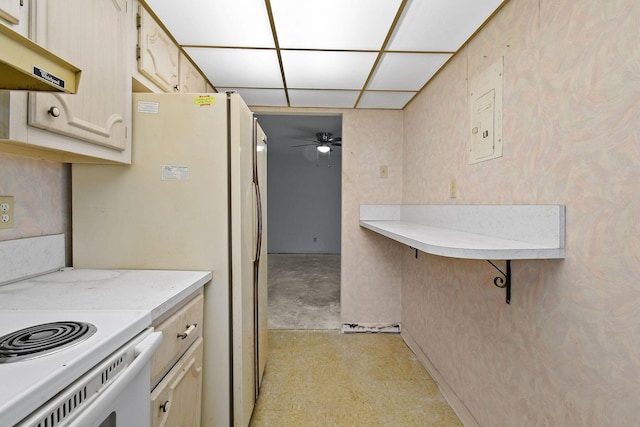 kitchen with ceiling fan and a drop ceiling