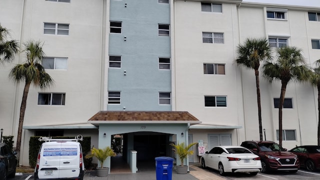 109 Paradise Harbour Blvd Unit 309, North Palm Beach, FL 33408 - view of apartment building / complex featuring uncovered parking