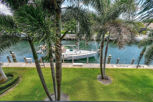 109 Paradise Harbour Blvd Unit 309, North Palm Beach, FL 33408 - dock area with a water view, a yard, and boat lift