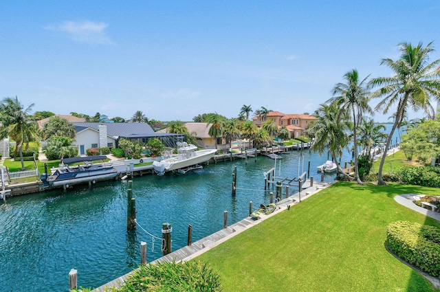 109 Paradise Harbour Blvd Unit 309, North Palm Beach, FL 33408 - water view featuring a boat dock and nearby suburban area
