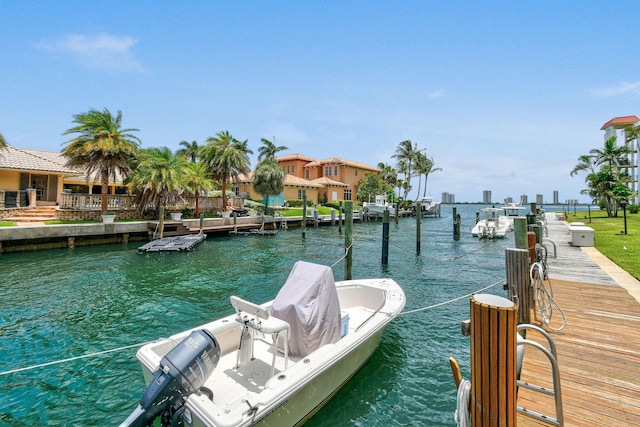 109 Paradise Harbour Blvd Unit 309, North Palm Beach, FL 33408 - dock featuring a water view