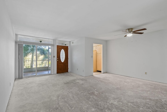 unfurnished living room featuring ceiling fan