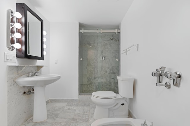 bathroom featuring sink, a bidet, an enclosed shower, and toilet