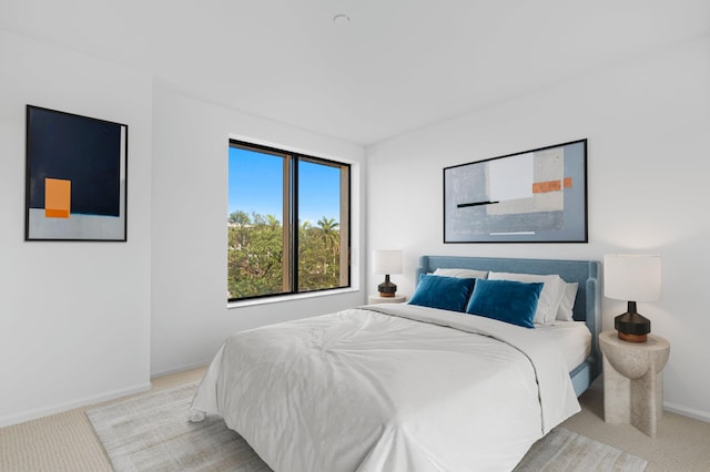 bedroom featuring light colored carpet