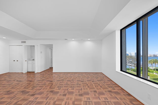 empty room featuring dark parquet flooring