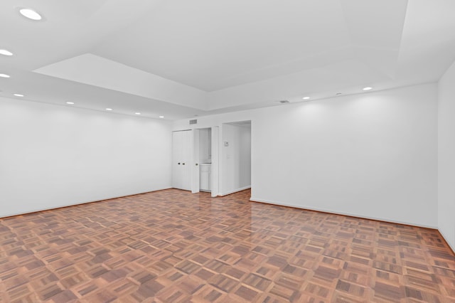 basement with dark parquet flooring