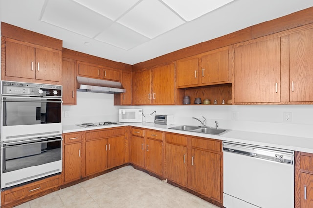 kitchen with white appliances and sink